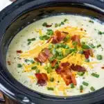 Creamy potato soup crock pot recipe with hash browns topped with bacon and cheese