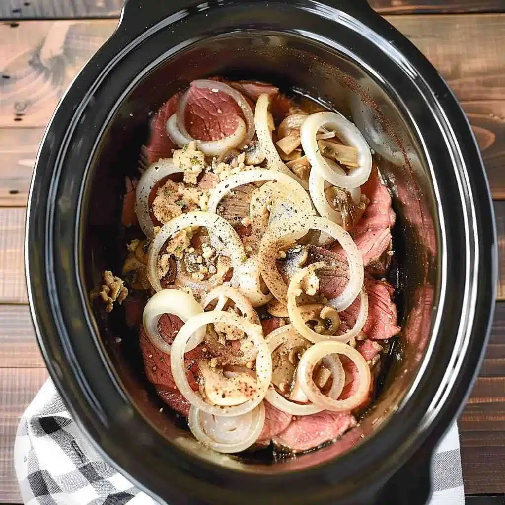 Layering round steak and vegetables in crock pot